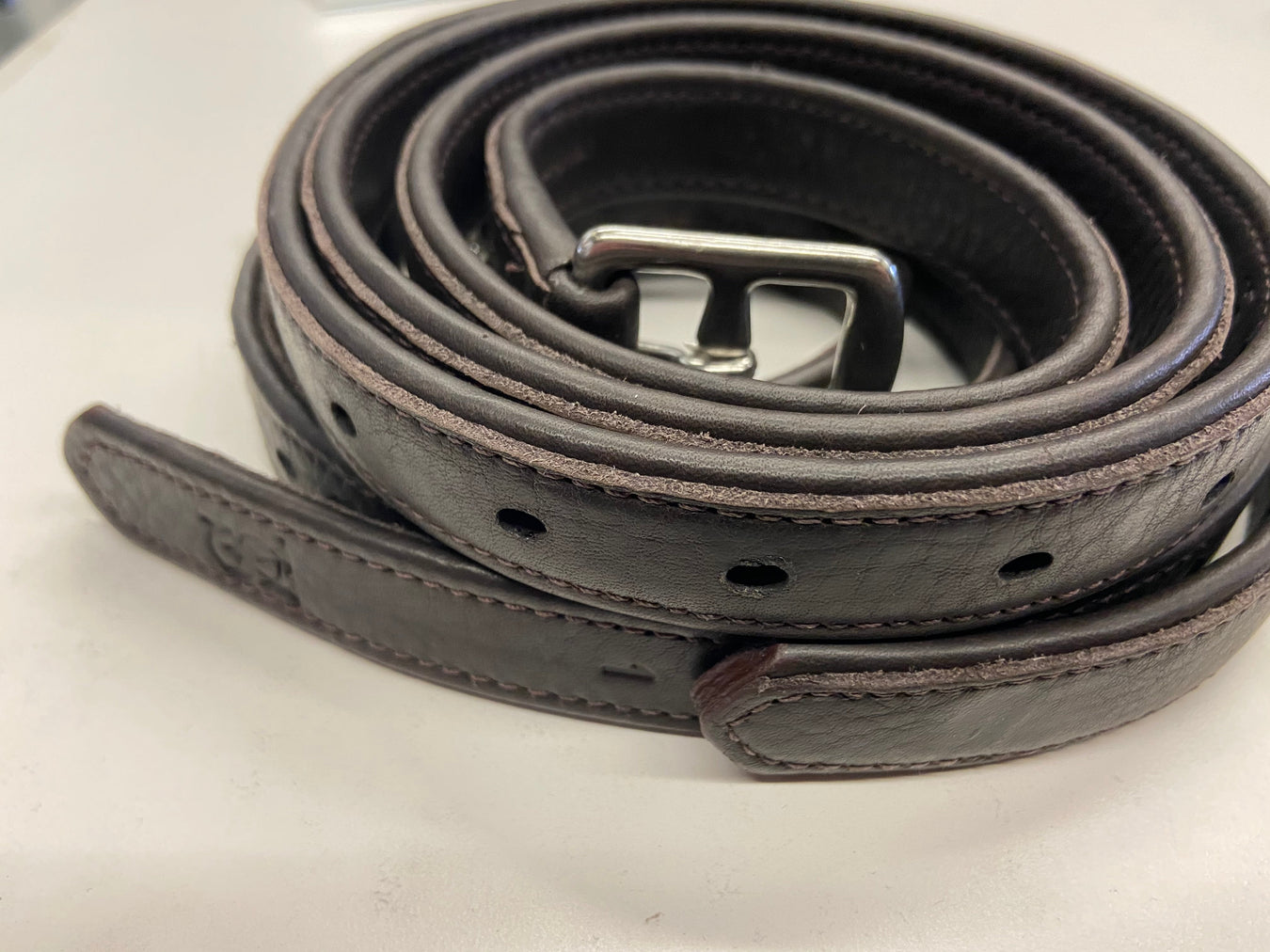 Vision nylon-lined calfskin stirrup leathers with metal buckles, showcasing smooth leather finish and secure fastening clips.
