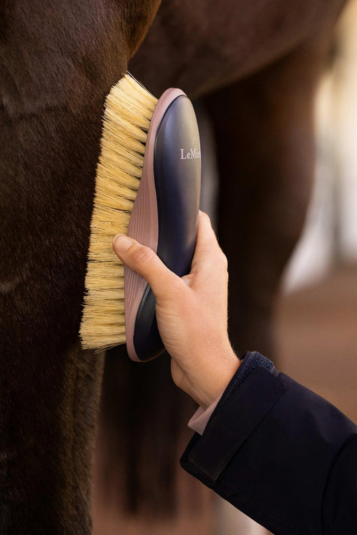 LeMieux Lemieux navy body brush for grooming, showing a handheld grooming brush with navy blue bristles and handle.