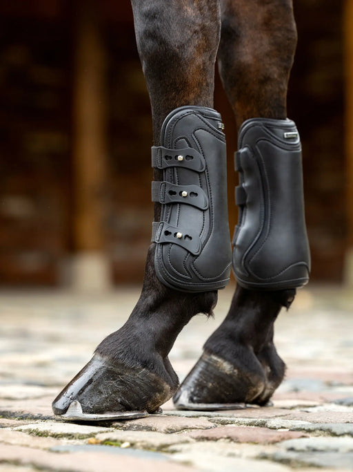 LeMieux Capella 3 Strap Tendon Boots for horses in black, designed for leg protection during riding or training.