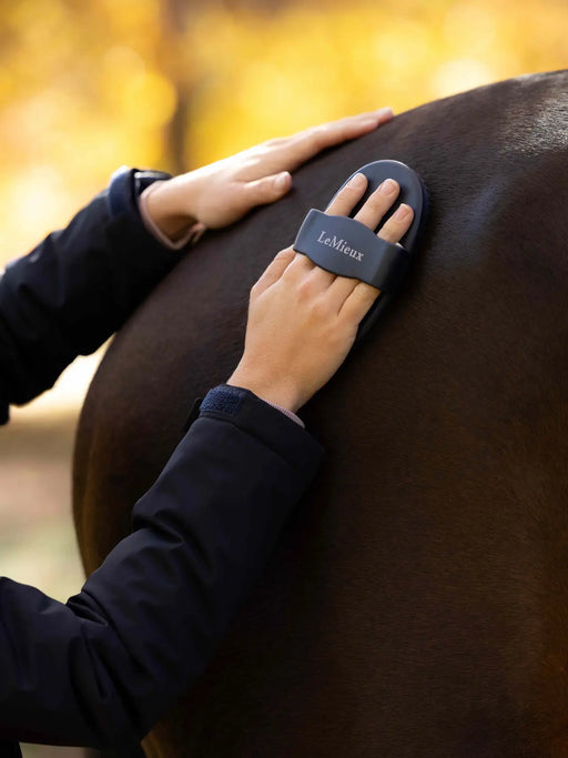LeMieux navy rubber curry comb for grooming, shown in close-up with textured rubber bristles for effective horse grooming.