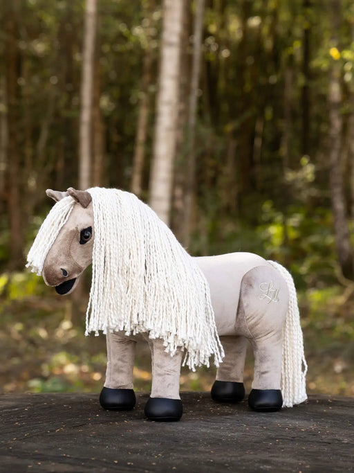 LeMieux Toy Pony Aurelia, soft plush toy horse with realistic features, ideal for children, in a natural setting.